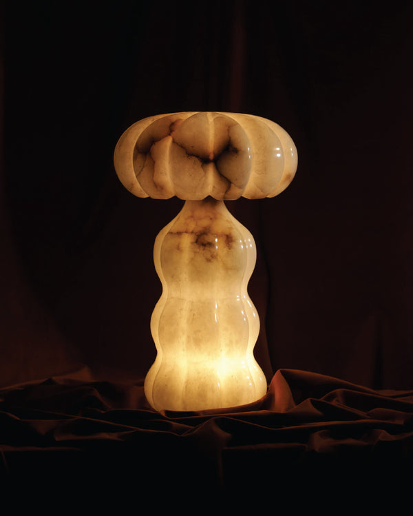 Barq table lamp casting warm ambient glow