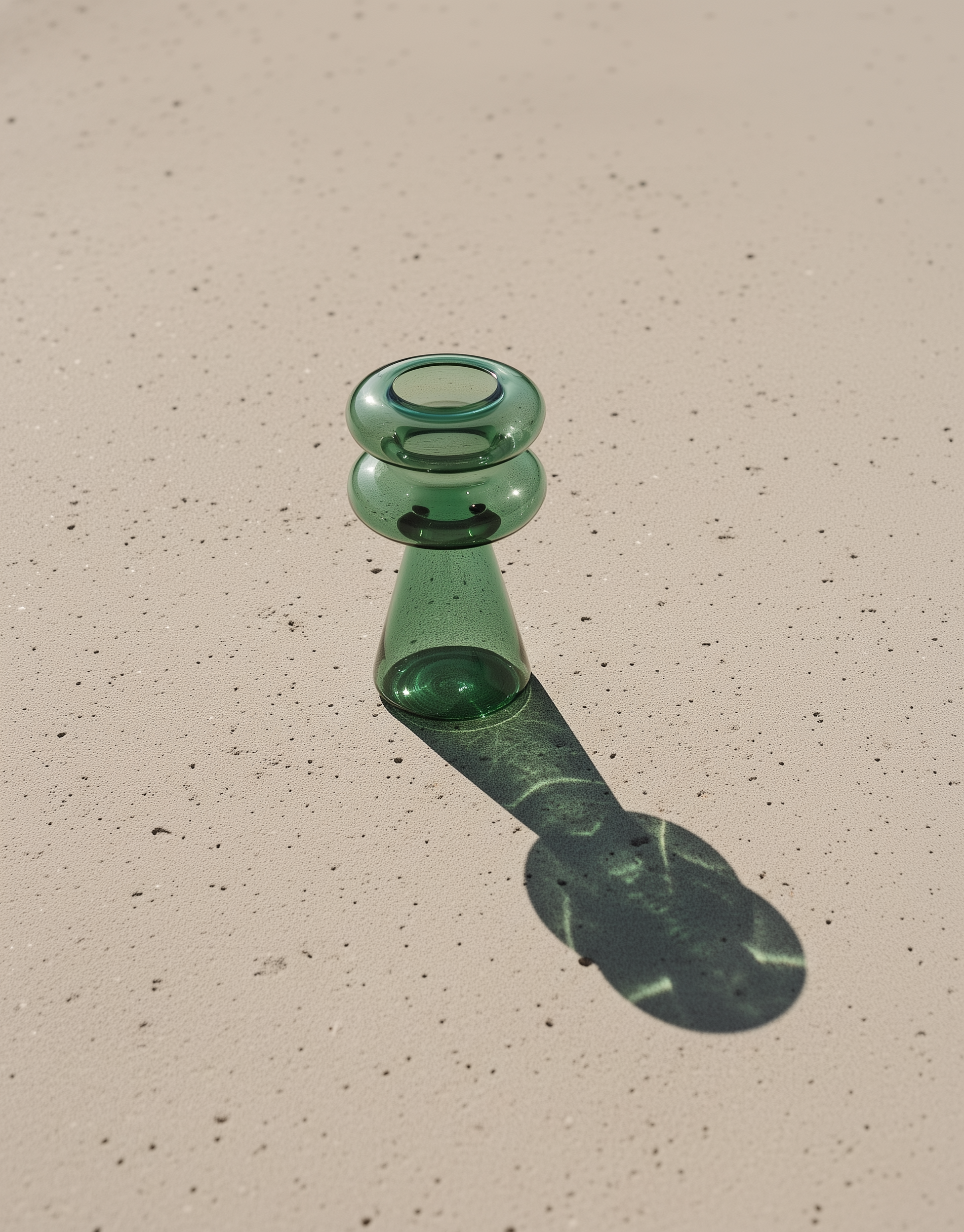 Mugen File Vase in teal handblown glass styled in a minimal setting