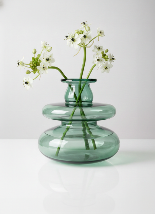 Mugen Loft Vase in teal handblown glass styled in a minimal interior setting