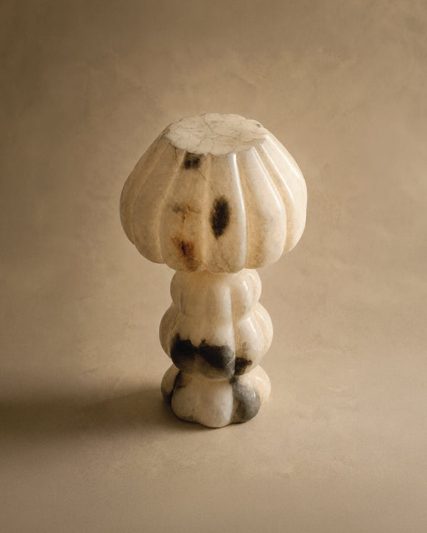 Noura Table Lamp showing sculptural alabaster form, three-quarter view