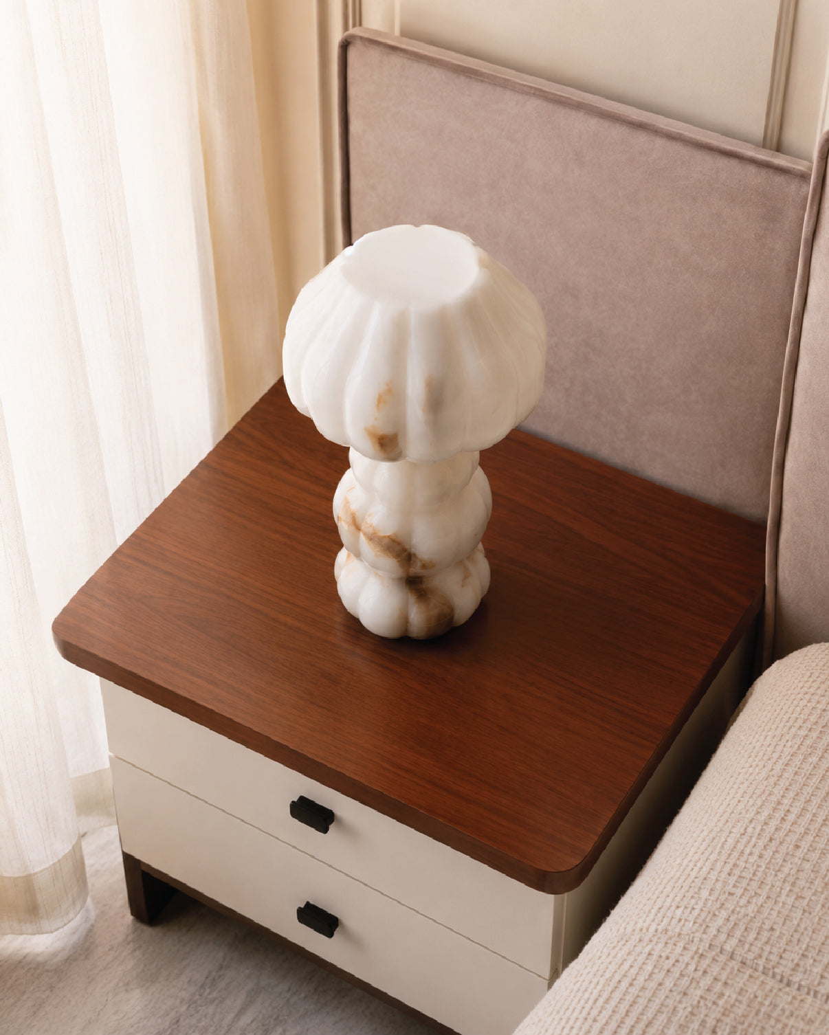 Noura Table Lamp styled as sculptural object in a modern interior
