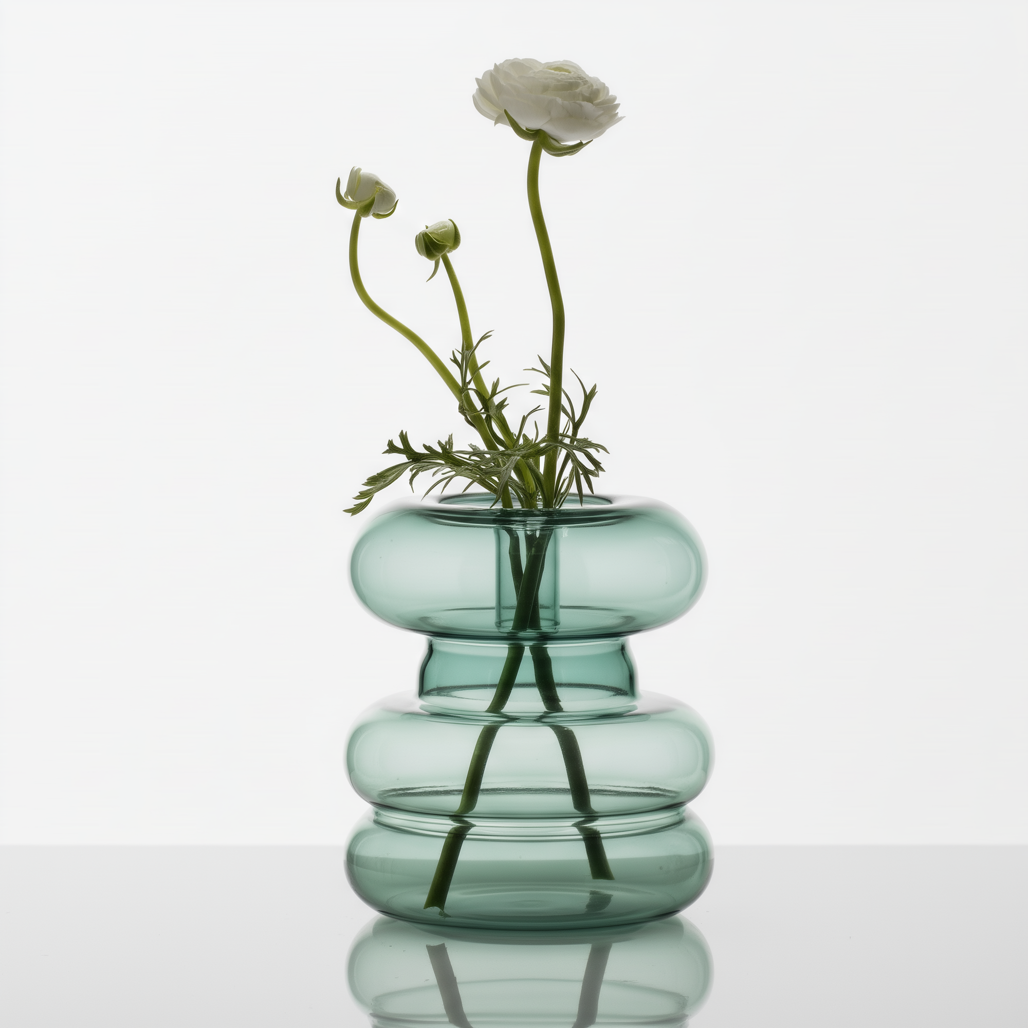 Mugen Shella Vase in teal handblown glass styled in a minimal interior setting